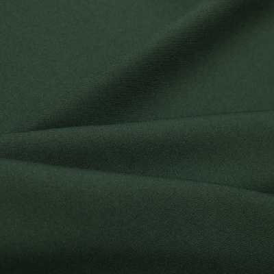 Ткань костюмная 21010 2076, 225 гр/м2, шир.150см, цвет т.зеленый - купить в Балаково. Цена 390.73 руб.